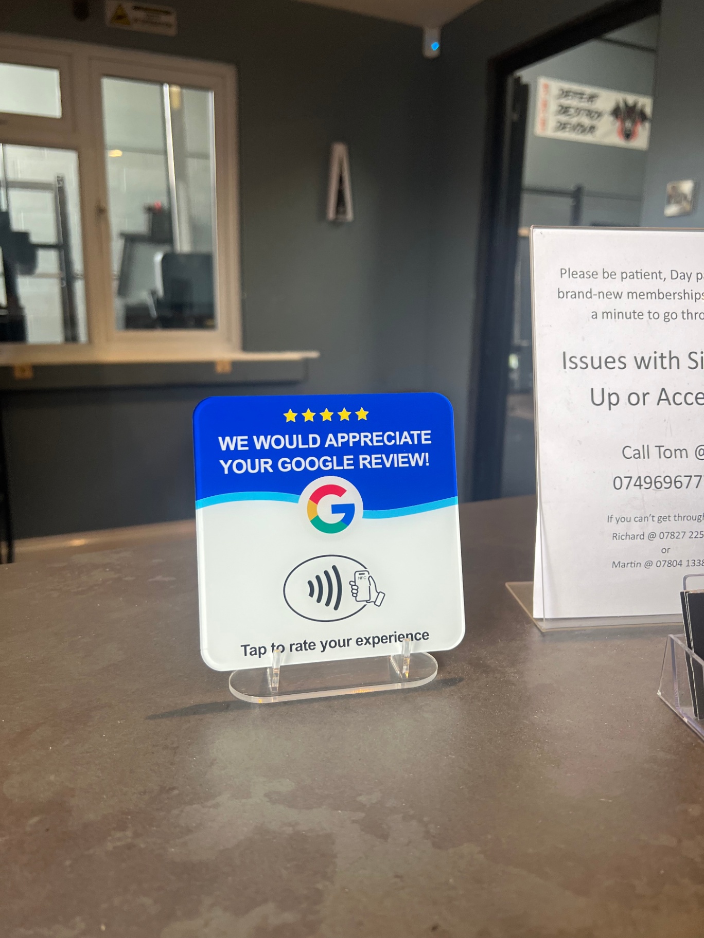 TapGrade NFC stand on a cafe counter
